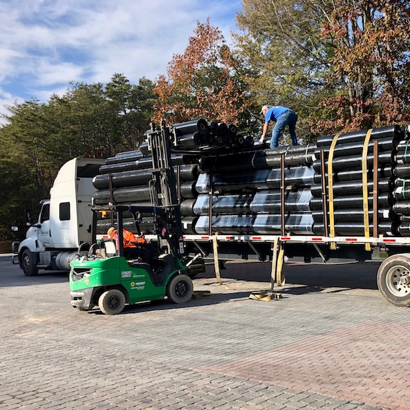 Loading truck with geosynthetics