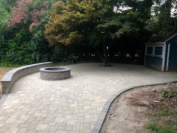 Hardscape with wall and fire pit