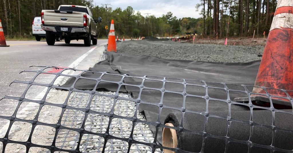 Bi-axial geogrid and nonwoven geotextile on construction site