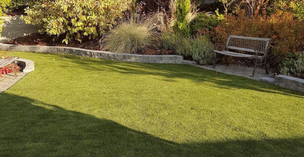 Synthetic turf landscape with hardscape edging