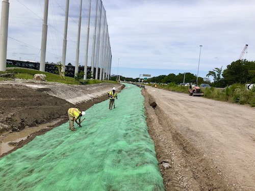 Installation crew installing Recyclex TRM on highway expansion project