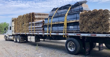 Truck full of erosion control products and geotextiles