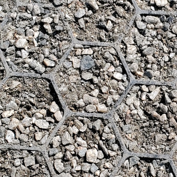 Up close filled EZ-Roll Gravel Paver for permeable parking lot