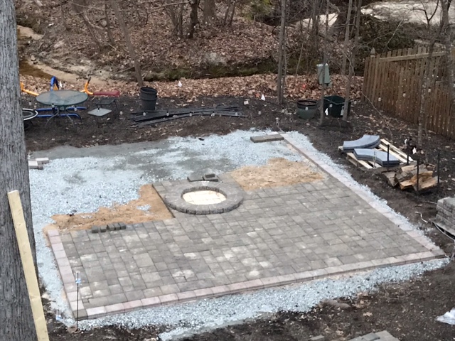 Laying pavers for patio and fire pit