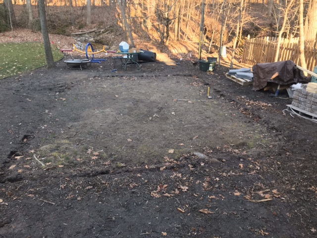 Before paver patio in residential backyard