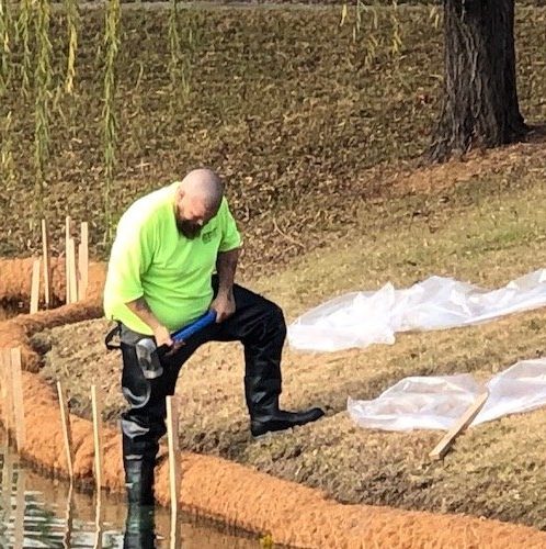 Coir log installed around retention pond
