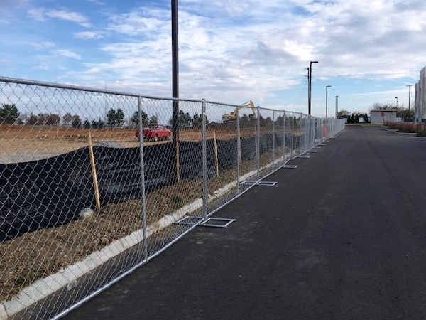 Temporary chain link fence protects new development