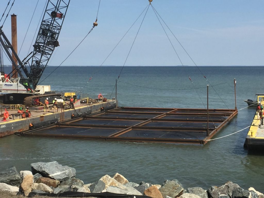 Lowing geotextile fabric panels into Chesapeake Bay