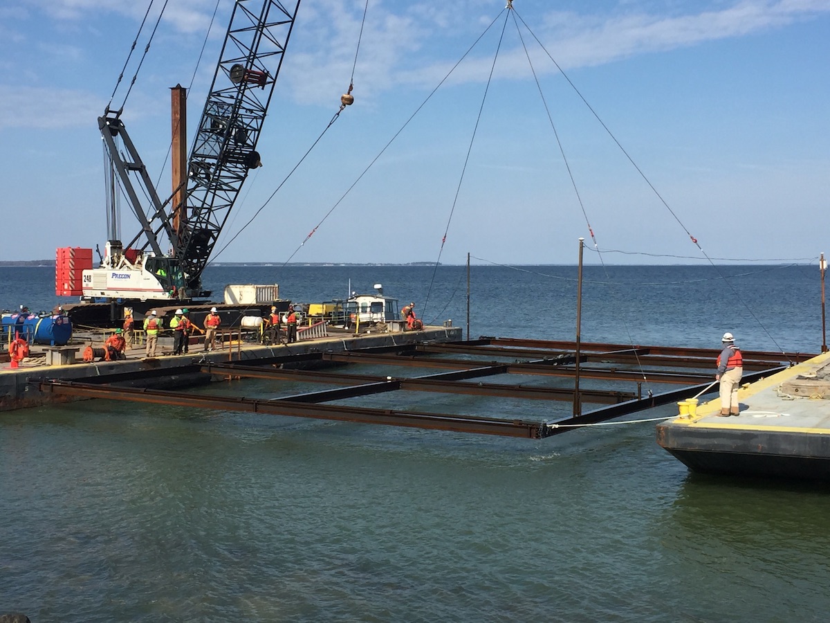 Dredge sinking geotextiles into Chesapeake Bay