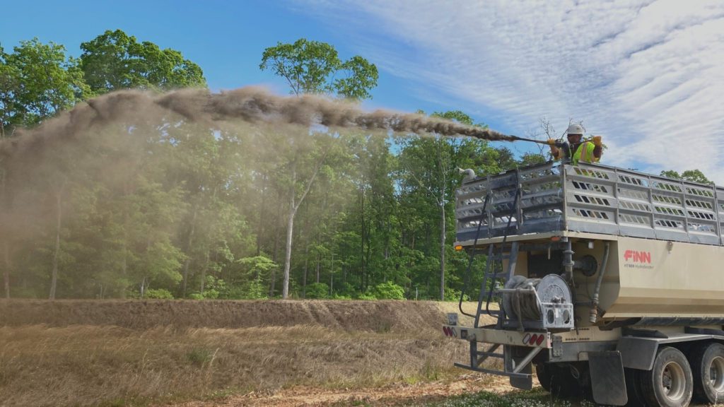 Spraying Biotic Soil Ammendment on soil