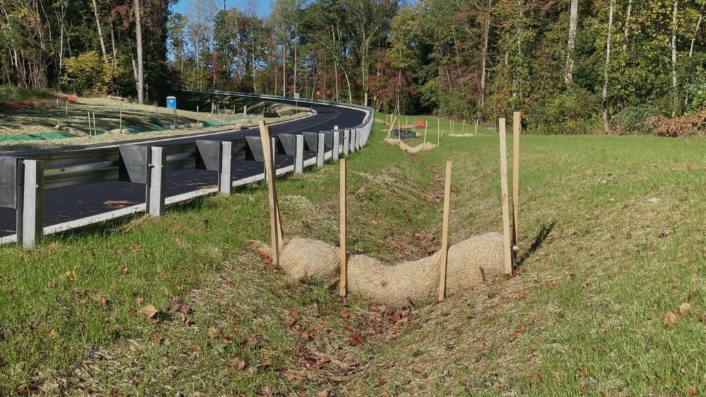 Curlex Sediment Log installed as check dam in swale
