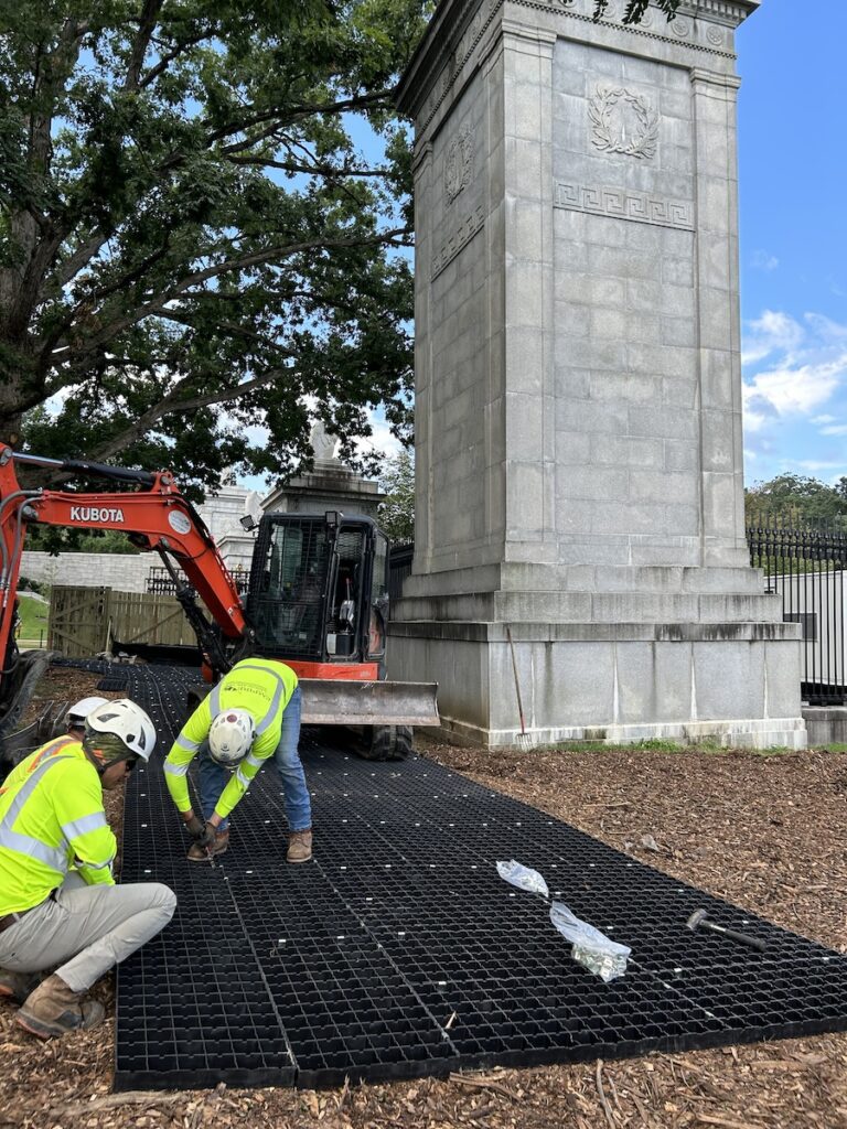 Ground protection mats for statue project