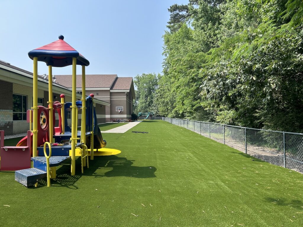Playground with synthetic turf