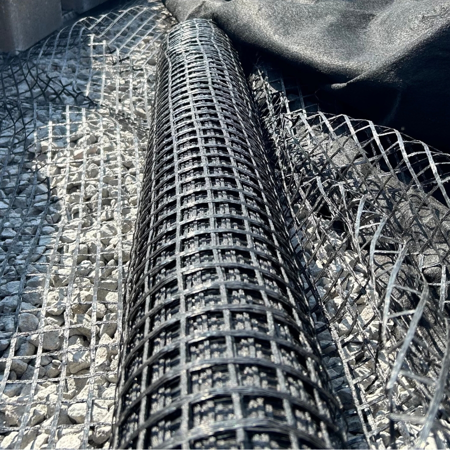 Uni-axial geogrid supports retaining wall