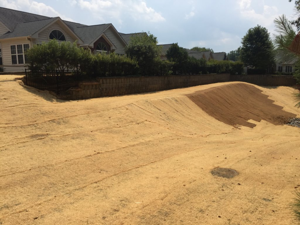 Straw matting behind residential development