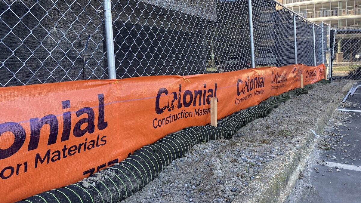 Silt sock reinforced logo silt fence at a retirement home in Virginia Beach